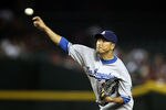 PHOENIX, AZ - SEPTEMBER 27:  Starting pitcher Hiroki Kuroda #18 of the Los Angeles Dodgers pitches against the Arizona Diamondbacks during the Major League Baseball game at Chase Field on September 27, 2011 in Phoenix, Arizona.  (Photo by Christian Petersen/Getty Images)