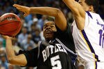 GREENSBORO, NC - MARCH 19:  Ronald Nored #5 of the Butler Bulldogs drives against Bo Spencer #11 of the Louisiana State University Tigers during the first round of the NCAA Division I Men's Basketball Tournament at the Greensboro Coliseum on March 19, 2009 in Greensboro, North Carolina.  (Photo by Streeter Lecka/Getty Images)