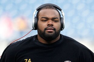 FOXBORO, MA - JANUARY 22:  Michael Oher #74 of the Baltimore Ravens warms up prior to their AFC Championship Game against the New England Patriots at Gillette Stadium on January 22, 2012 in Foxboro, Massachusetts.  (Photo by Rob Carr/Getty Images)