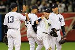 NEW YORK, NY - OCTOBER 01:  (L-R) Alex Rodriguez #13, Robinson Cano #24, Nick Swisher #33 and Derek Jeter #2 of the New York Yankees celebrate their 9-3 win over the Detroit Tigers in Game One of the American League Division Series at Yankee Stadium on October 1, 2011 in New York City.  (Photo by Chris Trotman/Getty Images)