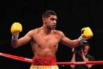 WASHINGTON, DC - DECEMBER 10:  Amir Khan taunts Lamont Peterson during their WBA Super Lightweight and IBF Junior Welterweight title fight at Washington Convention Center on December 10, 2011 in Washington, DC.  (Photo by Al Bello/Getty Images)