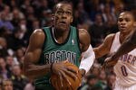 BOSTON, MA - JANUARY 16:  Rajon Rondo #9 of the Boston Celtics heads for the net as Russell Westbrook #0 of the Oklahoma City Thunder defends on January 16, 2012 at TD Garden in Boston, Massachusetts. NOTE TO USER: User expressly acknowledges and agrees that, by downloading and or using this photograph, User is consenting to the terms and conditions of the Getty Images License Agreement.  (Photo by Elsa/Getty Images)