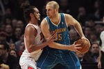 CHICAGO, IL - FEBRUARY 28:  Chris Kaman #35 of the New Orleans Hornets tries to move against Joakim Noah #13 of the Chicago Bulls at the United Center on February 28, 2012 in Chicago, Illinois. The Bulls defeated the Hornets 99-95. NOTE TO USER: User expressly acknowledges and agrees that, by downloading and or using this photograph, User is consenting to the terms and conditions of the Getty Images License Agreement.  (Photo by Jonathan Daniel/Getty Images)