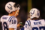 SAN DIEGO - JANUARY 03:  Wide receiver Reggie Wayne #87 of the Indianapolis Colts talks with quaterback Peyton Manning #18 during the AFC Wild Card Game against the San Diego Chargers on January 3, 2009 at Qualcomm Stadium in San Diego, California.  (Photo by Harry How/Getty Images)