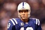 INDIANAPOLIS, IN - JANUARY 08:  Quarterback Peyton Manning #18 of the Indianapolis Colts looks on during warm ups against the New York Jets during their 2011 AFC wild card playoff game at Lucas Oil Stadium on January 8, 2011 in Indianapolis, Indiana.  (Photo by Andy Lyons/Getty Images)