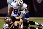 NEW ORLEANS - DECEMBER 19:  Drew Brees #9 of the New Orleans Saints is sacked by Spencer Anthony #92 of the Dallas Cowboys at the Louisiana Superdome on December 19, 2009 in New Orleans, Louisiana.  (Photo by Chris Graythen/Getty Images)