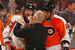 PHILADELPHIA, PA - MARCH 06:  Jakub Voracek #93 of the Philadelphia Flyers (L) is tended to by a trainer  after getting hurt during the second period against the Detroit Red Wings at Wells Fargo Center on March 6, 2012 in Philadelphia, Pennsylvania.  (Photo by Rob Carr/Getty Images)