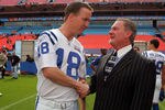 MIAMI GARDENS, FL - JANUARY 30:  Quarterback Peyton Manning #18 of the Indianapolis Colts shakes hands with team owner Jim Irsay during Media Day at Dolphin Stadium on January 30, 2007 in Miami Gardens, Florida.  (Photo by Scott Halleran/Getty Images)