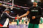 LOS ANGELES, CA - JUNE 15:  Director Spike Lee gives Rasheed Wallace #30 of the Boston Celtics a five during half time of Game Six of the 2010 NBA Finals between the Celtics and the Los Angeles Lakers at Staples Center on June 15, 2010 in Los Angeles, California.  NOTE TO USER: User expressly acknowledges and agrees that, by downloading and/or using this Photograph, user is consenting to the terms and conditions of the Getty Images License Agreement.  (Photo by Ronald Martinez/Getty Images)