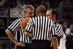 CORAL GABLES, FL - DECEMBER 02: Officials Brian Kersey,Mike Wood and Tony Greene discuss a call as the Ohio State Buckeyes take on the Miami Hurricanes at BankUnited Center on December 2, 2008 in Coral Gables, Florida. Ohio State defeated Miami 73-68.  (Photo by Doug Benc/Getty Images)