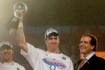 MIAMI GARDENS, FL - FEBRUARY 04:  Quarterback Peyton Manning #18 of the Indianapolis Colts celebrates with the Vince Lombardi Super Bowl trophy next to head coach Tony Dungy and is wife, Lauren, and CBS sports broadcaster Jim Nantz after winning the Super Bowl XLI 29-17 over the Chicago Bears on February 4, 2007 at Dolphin Stadium in Miami Gardens, Florida.  (Photo by Donald Miralle/Getty Images)