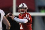 MADISON, WI - NOVEMBER 05: Joe Brennan #11 of the Wisconsin Badgers passes the ball against Joe Holland #30 of the Purdue Boilermakers at Camp Randall Stadium on November 5, 2011 in Madison Wisconsin. Wisconsin defeated Purdue 62-17. (Photo by Jonathan Daniel/Getty Images)