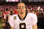 SAN FRANCISCO, CA - JANUARY 14:  Drew Brees #9 of the New Orleans Saints reacts after they lost their game against the the San Francisco 49ers in the NFC Divisional playoff game at Candlestick Park on January 14, 2012 in San Francisco, California.  (Photo by Ezra Shaw/Getty Images)
