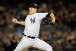 NEW YORK, NY - OCTOBER 06:  David Robertson #30 of the New York Yankees throws a pitch against the Detroit Tigers during Game Five of the American League Championship Series at Yankee Stadium on October 6, 2011 in the Bronx borough of New York City.  (Photo by Patrick McDermott/Getty Images)