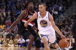 OAKLAND, CA - FEBRUARY 15: Stephen Curry #30 of the Golden State Warriors dribbles past Gerald Wallace #3 of the Portland Trail Blazers at Oracle Arena on February 15, 2012 in Oakland, California. NOTE TO USER: User expressly acknowledges and agrees that, by downloading and or using this photograph, User is consenting to the terms and conditions of the Getty Images License Agreement.  (Photo by Ezra Shaw/Getty Images)