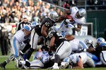 OAKLAND, CA - DECEMBER 18:  Kevin Smith #30 of the Detroit Lions dives over the top but is stopped short of a first down by Aaron Curry #51, Mike Mitchell #34 and Tommy Kelly #93 of the Oakland Raiders at O.co Coliseum on December 18, 2011 in Oakland, California.  (Photo by Thearon W. Henderson/Getty Images)