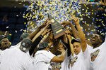 NEW ORLEANS, LA - MARCH 11:  The Vanderbilt Commodores celebrate with the trophy after their 71 to 64 win over the Kentucky Wildcats in the championship game of the 2012 SEC Men's Basketball Tournament at New Orleans Arena on March 11, 2012 in New Orleans, Louisiana.  (Photo by Chris Graythen/Getty Images)