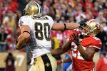 SAN FRANCISCO, CA - JANUARY 14:  Jimmy Graham #80 of New Orleans Saints pushes away from Carlos Rogers #22 of the San Francisco 49ers and goes 66 yards for a touchdown in the fourth quarter during the NFC Divisional playoff game at Candlestick Park on January 14, 2012 in San Francisco, California. (Photo by Thearon W. Henderson/Getty Images)