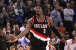 OAKLAND, CA - FEBRUARY 15:  Jamal Crawford #11 is congratulated by Gerald Wallace #3 of the Portland Trail Blazers after making a basket during their game against the Golden State Warriors at Oracle Arena on February 15, 2012 in Oakland, California. NOTE TO USER: User expressly acknowledges and agrees that, by downloading and or using this photograph, User is consenting to the terms and conditions of the Getty Images License Agreement.  (Photo by Ezra Shaw/Getty Images)
