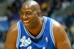 LOS ANGELES - FEBRUARY 14:  Magic Johnson of the Los Angeles Lakers Team laughs during the RadioShack Shooting Stars Competition, part of the 53rd NBA All-Star weekend on February 14, 2004 at the Staples Center in Los Angeles, California.  NOTE TO USER: User expressly acknowledges and agrees that, by downloading and/or using this Photograph, User is consenting to the terms and conditions of the Getty Images License Agreement.  (Photo by Jed Jacobsohn/Getty Images)