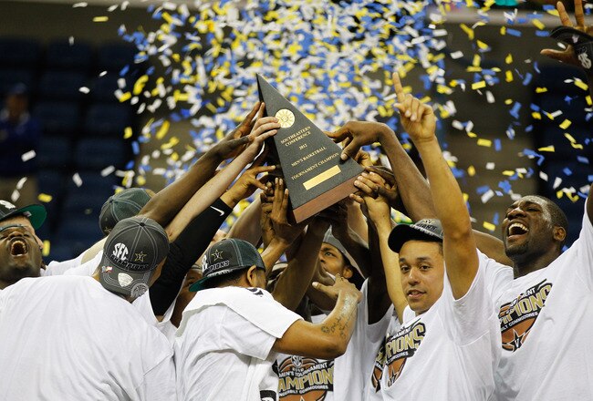 NEW ORLEANS, LA - MARCH 11:  The Vanderbilt Commodores celebrate with the trophy after their 71 to 64 win over the Kentucky Wildcats in the championship game of the 2012 SEC Men's Basketball Tournament at New Orleans Arena on March 11, 2012 in New Orleans, Louisiana.  (Photo by Chris Graythen/Getty Images)