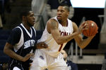 BRIDGEPORT, CT - MARCH 07:  Mike Glover #1 of the Iona Gaels looks to pass as he is defended by Ryan Bacon #4 of the St. Peter's Peacocks during the final of the MAAC men's conference basketball tournment at Webster Bank Arena at Harbor Yard on March 7, 2011 in Bridgeport, Connecticut.  (Photo by Chris Chambers/Getty Images)