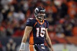 DENVER, CO - JANUARY 08:  Quarterback Tim Tebow #15 of the Denver Broncos looks on during the AFC Wild Card Playoff game at Sports Authority Field against the Pittsburgh Steelers at Mile High on January 8, 2012 in Denver, Colorado.  (Photo by Jeff Gross/Getty Images)