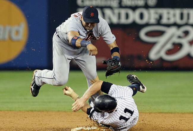NEW YORK - AUGUST 16:  Brett Gardner #11 of the New York Yankees collides with Carlos Guillen #9 of the Detroit Tigers after completing a game ending double play on August 16, 2010 at Yankee Stadium in the Bronx borough of New York City. The Tigers defeated the Yankees 3-1.  (Photo by Jim McIsaac/Getty Images)