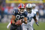 ORCHARD PARK, NY - NOVEMBER 14:  Lee Evans #83  of the Buffalo Bills makes a finger tip catch against Chris Houston #23 of the Detroit Lions at Ralph Wilson Stadium on November 14, 2010 in Orchard Park, New York. The Bills won 14-12. (Photo by Rick Stewart/Getty Images)