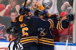 BUFFALO, NY - MARCH 12: Mike Weber #6 and Tyler Ennis #63 of the Buffalo Sabres celebrate Ennis' goal to tie the game in the second period against the Montreal Canadiens at First Niagara Center on March 12, 2012 in Buffalo, New York.  (Photo by Rick Stewart/Getty Images)