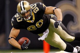 NEW ORLEANS, LA - DECEMBER 12:  Jimmy Graham #80 of the New Orleans Saints is tackled by Craig Dahl #43 of the St. Louis Rams at the Louisiana Superdome on December 12, 2010 in New Orleans, Louisiana.  (Photo by Chris Graythen/Getty Images)