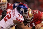 SAN FRANCISCO, CA - JANUARY 22:  Osi Umenyiora #72 of the New York Giants sackes Alex Smith #11 of the San Francisco 49ers in the second half during the NFC Championship Game at Candlestick Park on January 22, 2012 in San Francisco, California.  (Photo by Doug Pensinger/Getty Images)