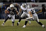 SAN DIEGO, CA - NOVEMBER 10:  Vincent Jackson #83 of the San Diego Chargers is met by  Matt Giordano #27 and Tyvon Branch #33 of the Oakland Raiders after his catch at Qualcomm Stadium on November 10, 2011 in San Diego, California.  (Photo by Harry How/Getty Images)