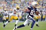 SAN DIEGO, CA - NOVEMBER 06:   Vincent Jackson #83 of the San Diego Chargers runs as Desmond Bishop #55 of the Green Bay Packers chases after a catch during the first quarter at Qualcomm Stadium on November 6, 2011 in San Diego, California.  (Photo by Harry How/Getty Images)