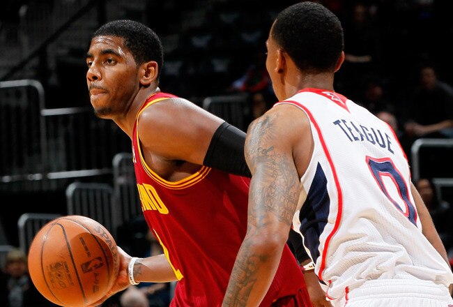 ATLANTA, GA - JANUARY 21:  Kyrie Irving #2 of the Cleveland Cavaliers runs the point against Jeff Teague #0 of the Atlanta Hawks at Philips Arena on January 21, 2012 in Atlanta, Georgia.  NOTE TO USER: User expressly acknowledges and agrees that, by downloading and or using this photograph, User is consenting to the terms and conditions of the Getty Images License Agreement.  (Photo by Kevin C. Cox/Getty Images)