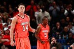 NEW YORK, NY - MARCH 10:  Kyle Kuric #14 and Chris Smith #5 of the Louisville Cardinals reacts after a play against the Cincinnati Bearcats during the finals of the Big East Men's Basketball Tournament at Madison Square Garden at Madison Square Garden on March 10, 2012 in New York City.  (Photo by Chris Trotman/Getty Images)