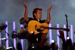 INDIANAPOLIS - SEPTEMBER 06:  Musician John Mellencamp performs before the Indianapolis Colts take on the New Orleans Saints in the first NFL game of the season at the RCA Dome on September 6, 2007 in Indianapolis, Indiana.  (Photo by Jonathan Daniel/Getty Images)