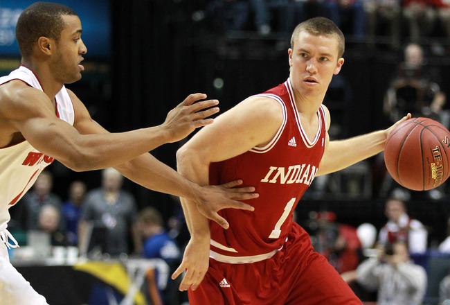 INDIANAPOLIS, IN - MARCH 09:  Jordan Hulls #1 of the Indiana Hoosiers looks to pass against Jordan Taylor #11 of the Wisconsin Badgers during their quarterfinal game of 2012 Big Ten Men's Basketball Conferene Tournament at Bankers Life Fieldhouse on March 9, 2012 in Indianapolis, Indiana  (Photo by Andy Lyons/Getty Images)