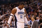 ORLANDO, FL - MARCH 13:  Dwight Howard #12 of the Orlando Magic walks off the court during the game against the Miami Heat at Amway Center on March 13, 2012 in Orlando, Florida.  NOTE TO USER: User expressly acknowledges and agrees that, by downloading and or using this photograph, User is consenting to the terms and conditions of the Getty Images License Agreement.  (Photo by Sam Greenwood/Getty Images)