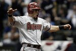 MILWAUKEE, WI - OCTOBER 07:  Gerardo Parra #8 of the Arizona Diamondbacks celebrates after scoring the tying run in the 9th inning against the Milwaukee Brewers during Game Five of the National League Division Series at Miller Park on October 7, 2011 in Milwaukee, Wisconsin.  (Photo by Jared Wickerham/Getty Images)