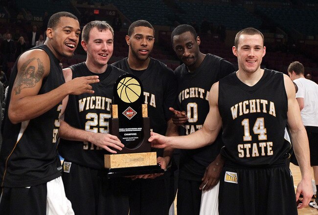 NEW YORK, NY - MARCH 31:  Derek Brown #25,JT Durley #31, Graham Hatch #14, Aaron Ellis #0 and Gabe Blair #32 of the Wichita State Shockers celebrate with the trophy after defeating the Alabama Crimson Tide to win the 2011 NIT Championship game on March 31, 2011 at Madison Square Garden in New York City. Wichita State defeated Alabama 66-57.  (Photo by Jim McIsaac/Getty Images)