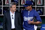 ANAHEIM, CA - JULY 1:  Manager Don Mattingly and general manager Ned Colletti of the Los Angeles Dodgers converse in the dugout before the game with the Los Angeles Angels of Anaheim on July 1, 2011 at Angel Stadium in Anaheim, California.   (Photo by Stephen Dunn/Getty Images)