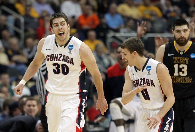PITTSBURGH, PA - MARCH 15:  Mike Hart #30 and David Stockton #11 of the Gonzaga Bulldogs celebrate against the West Virginia Mountaineers during the second round of the 2012 NCAA Men's Basketball Tournament at Consol Energy Center on March 15, 2012 in Pittsburgh, Pennsylvania.  (Photo by Gregory Shamus/Getty Images)