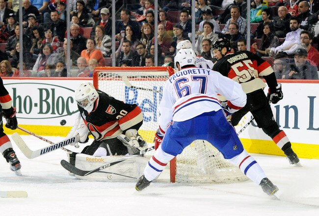MONTREAL, CANADA - MARCH 14:  Ben Bishop #30 of the Ottawa Senators stops the puck on an attempt by Max Pacioretty #67 of the Montreal Canadiens during the NHL game at the Bell Centre on March 14, 2012 in Montreal, Quebec, Canada.  (Photo by Richard Wolowicz/Getty Images)