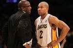 LOS ANGELES, CA - MARCH 11:  Head coach Mike Brown of the Los Angeles Lakers talks with Derek Fisher #2 during hte game against the Boston Celtics at Staples Center on March 11, 2012 in Los Angeles, California.  The Lakers won 97-94.  NOTE TO USER: User expressly acknowledges and agrees that, by downloading and or using this photograph, User is consenting to the terms and conditions of the Getty Images License Agreement.  (Photo by Stephen Dunn/Getty Images)