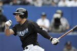 TORONTO, CANADA - SEPTEMBER 05:  Brett Lawrie #13 of the Toronto Blue Jays bats during MLB game action against the Boston Red Sox September 5, 2011 at Rogers Centre in Toronto, Ontario, Canada. (Photo by Brad White/Getty Images)