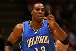 EAST RUTHERFORD, NJ - NOVEMBER 16:  Dwight Howard #12 of the Orlando Magic celebrates a basket against the New Jersey Nets during their game at the Izod Center on November 16, 2007 in East Rutherford, New Jersey.The Magic defeated the Nets 95-70. NOTE TO USER: User expressly acknowledges and agrees that, by downloading and/or using this Photograph, User is consenting to the terms and conditions of the Getty Images License Agreement.  (Photo by Jim McIsaac/Getty Images)