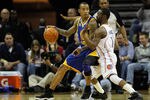 CHARLOTTE, NC - JANUARY 14:  Monta Ellis #8 of the Golden State Warriors posts up Kemba Walker #1 of the Charlotte Bobcats during their game at Time Warner Cable Arena on January 14, 2012 in Charlotte, North Carolina.  NOTE TO USER: User expressly acknowledges and agrees that, by downloading and or using this photograph, User is consenting to the terms and conditions of the Getty Images License Agreement.  (Photo by Streeter Lecka/Getty Images)