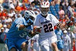 FOXBORO, MA - MAY 26:  Dan Hardy #22 of the Syracuse Orange drives against Andrew Miller #3 of the Johns Hopkins Blue Jays during the NCAA Lacrosse Championship at Gillette Stadium on May 26, 2008 in Foxboro, Massachusetts. Hardy scored three goals in the 13-10 victory. (Photo by Jim Rogash/Getty Images)