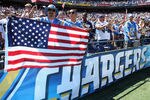 SAN DIEGO, CA - SEPTEMBER 11:  Fans hold up flags on the anniversary of 9/11 prior to the start of the game between the Minnesota Vikings and the San Diego Chargers at Qualcomm Stadium on September 11, 2011 in San Diego, California. The Chargers defeated the Vikings 24-17.  (Photo by Jeff Gross/Getty Images)